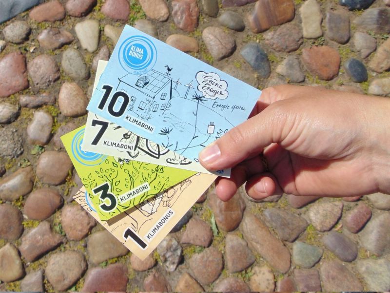 Datei:3 Die Währung Klimabonus.jpg